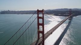 5K aerial stock footage of flying by Golden Gate Bridge with light traffic, revealing distant Downtown San Francisco, California Aerial Stock Footage | AXSF15_021