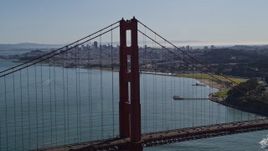 5K aerial stock footage of flying by Golden Gate Bridge, reveal Downtown San Francisco skyline, California Aerial Stock Footage | AXSF15_022