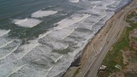5K aerial stock footage video of a reverse view of ocean waves and Great Highway, Lakeshore District, San Francisco, California Aerial Stock Footage | AXSF15_032
