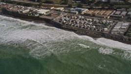 5K aerial stock footage of flying by oceanfront homes as waves roll in, Pacifica, California Aerial Stock Footage | AXSF15_038