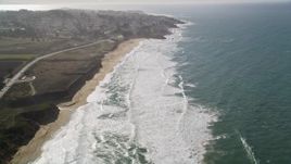 5K aerial stock footage of flying over Montara State Beach, tilt revealing coastal neighborhoods, Montara, California Aerial Stock Footage | AXSF15_046