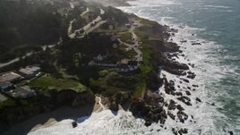 5K aerial stock footage of tilting from Montara State Beach, revealing coastal neighborhoods and lighthouse, Montara, California Aerial Stock Footage | AXSF15_047