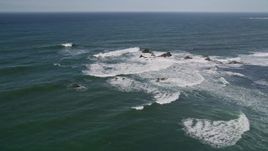 5K aerial stock footage of flying by waves crashing into rock formations, Half Moon Bay, California Aerial Stock Footage | AXSF15_053