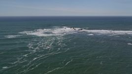 5K aerial stock footage of descending toward waves crashing into rock formations, Half Moon Bay, California Aerial Stock Footage | AXSF15_054