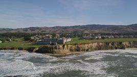 5K aerial stock footage of flying away from The Ritz Carlton hotel on coastal cliffs, Half Moon Bay, California Aerial Stock Footage | AXSF15_057
