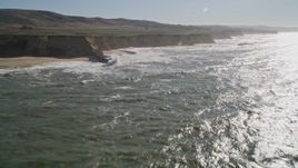 5K aerial stock footage of flying by coastal cliffs, Half Moon Bay, California Aerial Stock Footage | AXSF15_058