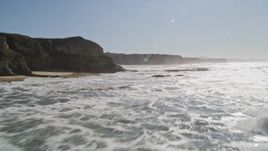 5K aerial stock footage fly low altitude by coastal cliffs and over rock formations, Half Moon Bay, California Aerial Stock Footage | AXSF15_059