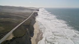 5K aerial stock footage of tilting from the coastal beach revealing Highway 1, San Gregorio, California Aerial Stock Footage | AXSF15_066