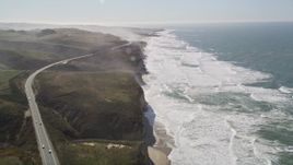 5K aerial stock footage tilt from Highway 1 and fly over coastal cliffs, Pescadero, California Aerial Stock Footage | AXSF15_069