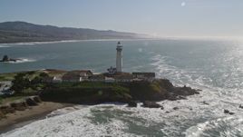 5K aerial stock footage of tilting from the ocean to reveal and flyby Pigeon Point Light Station, Pescadero, California Aerial Stock Footage | AXSF15_071