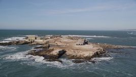 5K aerial stock footage of tilting from the ocean revealing Año Nuevo Island, California Aerial Stock Footage | AXSF15_076