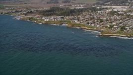5K aerial stock footage of passing by kelp forests and coastal neighborhoods, Santa Cruz, California Aerial Stock Footage | AXSF15_091