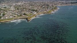 5K aerial stock footage of tilting from kelp forests to reveal coastal neighborhoods, Santa Cruz, California Aerial Stock Footage | AXSF15_095