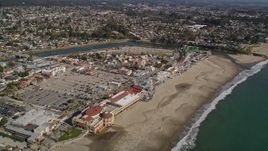 5K aerial stock footage of passing the beach and rides at Santa Cruz Beach Boardwalk, Santa Cruz, California Aerial Stock Footage | AXSF15_102