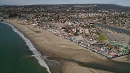5K aerial stock footage orbit and fly away from the beach and rides at the Santa Cruz Beach Boardwalk, Santa Cruz, California Aerial Stock Footage | AXSF15_105