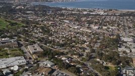 5K aerial  video tilt from neighborhood to reveal Monterey Peninsula and Monterey Bay, Monterey, California Aerial Stock Footage | AXSF15_121