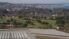 5K aerial stock footage tilt from golf course to reveal the coastal community of Monterey, California Aerial Stock Footage | AXSF15_122