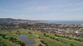 5K aerial stock footage approach Monterey Peninsula while flying over a golf course, Monterey, California Aerial Stock Footage | AXSF16_001