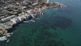 5K aerial stock footage tilt from kelp to reveal coastal neighborhoods and Monterey Bay Aquarium, Monterey, California Aerial Stock Footage | AXSF16_008