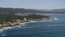 5K aerial stock footage of flying by oceanfront mansions on the coast in Pebble Beach, California Aerial Stock Footage | AXSF16_026