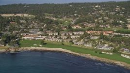 5K aerial stock footage reverse view of Pebble Beach Golf Links and Pebble Beach Resorts, California Aerial Stock Footage | AXSF16_033