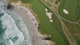 5K aerial stock footage of a bird's eye view of a beachfront golf course in Pebble Beach, California Aerial Stock Footage | AXSF16_035
