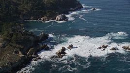 5K aerial stock footage of tilting from the coves along the coast to reveal coastal cliffs, Carmel, California Aerial Stock Footage | AXSF16_045