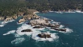 5K aerial stock footage of flying by rugged coastline with trees and rock formations, Carmel, California Aerial Stock Footage | AXSF16_049