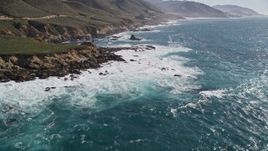 5K aerial stock footage of flying over kelp near waves crashing against coastal cliffs, Carmel, California Aerial Stock Footage | AXSF16_057