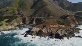 5K aerial stock footage of flying by the Highway 1 coastal road winding around the coastline, Carmel, California Aerial Stock Footage | AXSF16_064
