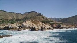 5K aerial stock footage flyby waves crashing into rocks below coastal homes, Carmel, California Aerial Stock Footage | AXSF16_065