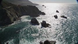 5K aerial stock footage approach waves rolling toward coastal rock formations, Big Sur, California Aerial Stock Footage | AXSF16_069