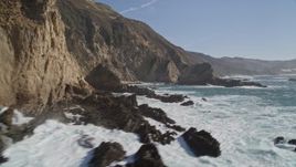 5K aerial stock footage of flying around coastal cliffs and rock formations, Big Sur, California Aerial Stock Footage | AXSF16_074