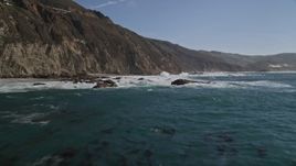 5K aerial stock footage fly low, tilt up to reveal rock formations and coastal cliffs, Big Sur, California Aerial Stock Footage | AXSF16_075