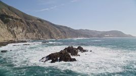 5K aerial stock footage of flying away from rock formations near coastal cliffs, Big Sur, California Aerial Stock Footage | AXSF16_080