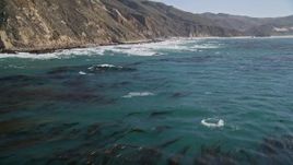 5K aerial stock footage flying over ocean kelp near coastal cliffs, Big Sur, California Aerial Stock Footage | AXSF16_082