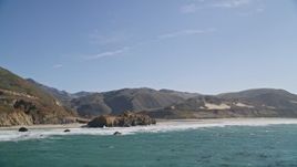 5K aerial stock footage of tilting from ocean kelp, reveal coastal rock formations and a beach, Big Sur, California Aerial Stock Footage | AXSF16_083