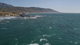 5K aerial stock footage tilt up from ocean to reveal wide view of coastline, Big Sur, California Aerial Stock Footage | AXSF16_093