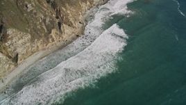 5K aerial stock footage of a bird's eye view of coastal cliffs, revealing rocky beach, Big Sur, California Aerial Stock Footage | AXSF16_110
