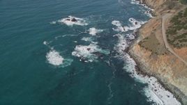 5K aerial stock footage of flying away from Highway 1 and coastal cliffs, Big Sur, California Aerial Stock Footage | AXSF16_128
