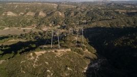 5K aerial stock footage following a row of power lines over hills, San Luis Obispo County, California Aerial Stock Footage | AXSF17_004