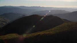 5K aerial stock footage of flying by a mountain landscape in San Luis Obispo County, California Aerial Stock Footage | AXSF17_021