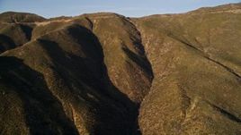 5K aerial stock footage of passing by mountain ridge, San Luis Obispo County, California Aerial Stock Footage | AXSF17_022