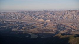 5K aerial stock footage of flying by Cuyama Valley and Caliente Mountain Range, San Luis Obispo, California Aerial Stock Footage | AXSF17_024