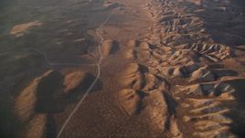 5K aerial stock footage of a reverse view of a road beside the San Andreas Fault, San Luis Obispo County, California Aerial Stock Footage | AXSF17_053