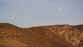 5K aerial stock footage flying by the a ridge in the Temblor Range with the moon overhead, San Luis Obispo County, California Aerial Stock Footage | AXSF17_056