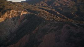 5K aerial stock footage tilt up mountainside to a road, Los Padres National Forest, California, sunset Aerial Stock Footage | AXSF17_057