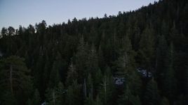 5K aerial stock footage of flying low over patches of snow and trees in Los Padres National Forest, California, twilight Aerial Stock Footage | AXSF17_063