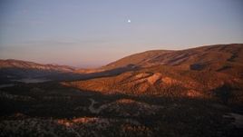 5K aerial stock footage of flying by mountains with moon above, Los Padres National Forest, California, sunset Aerial Stock Footage | AXSF17_065