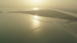 HD stock footage aerial video of a desert island at sunrise in Al Selmiyyah, Abu Dhabi, UAE Aerial Stock Footage | CAP_001_004